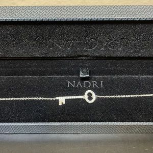 Nadri silver tone key bracelet with encrusted crystals